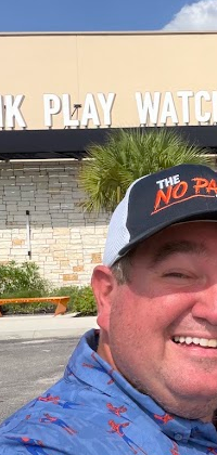 Richard outside Dave and Buster's in The No Pants Show cap